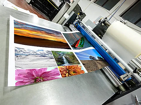 Roll laminator finishing a large-format print