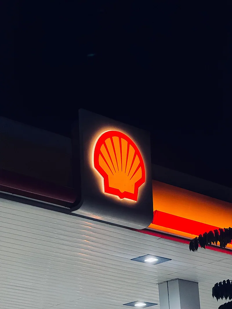 Illuminated fascia sign glowing at night