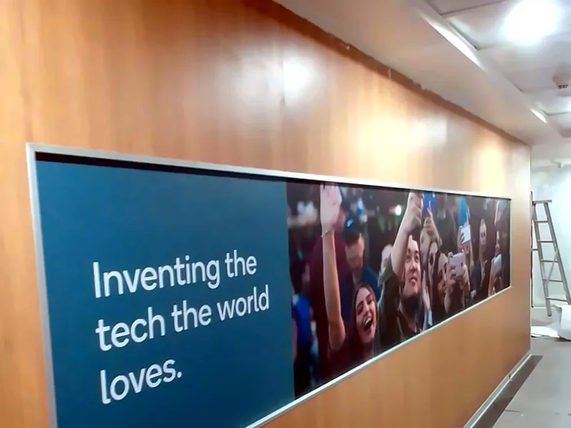 Wood-finish wall with a printed banner (DI-NOC Film)