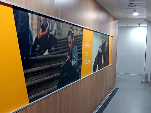 Wood-finish corridor with a printed panel (DI-NOC Film)