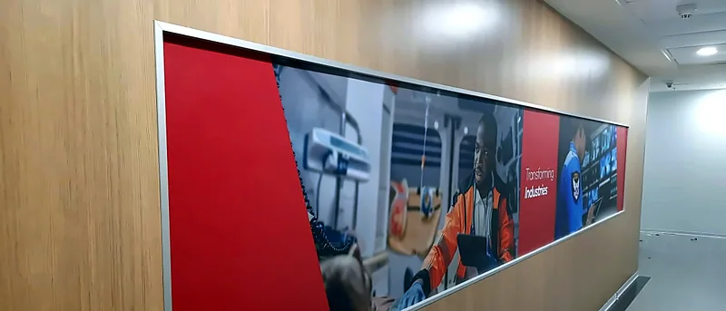 Long printed panel set into a wood-finish wall