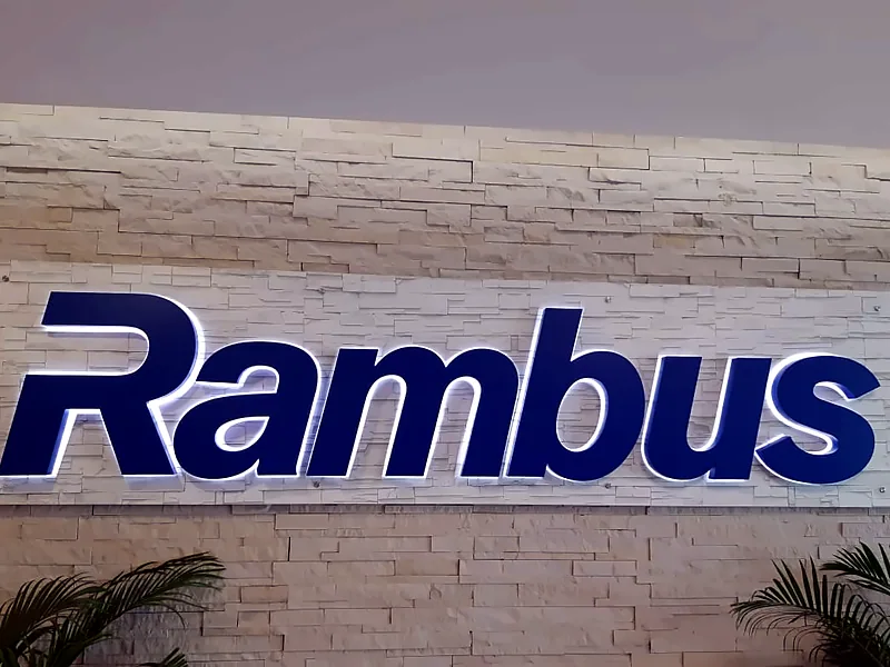 Flat halo-lit logo on stone cladding: Indoor Logo Signage