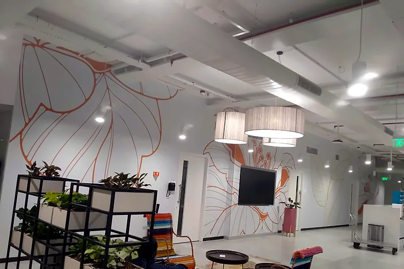 Line-art floral mural wrapping a lounge wall